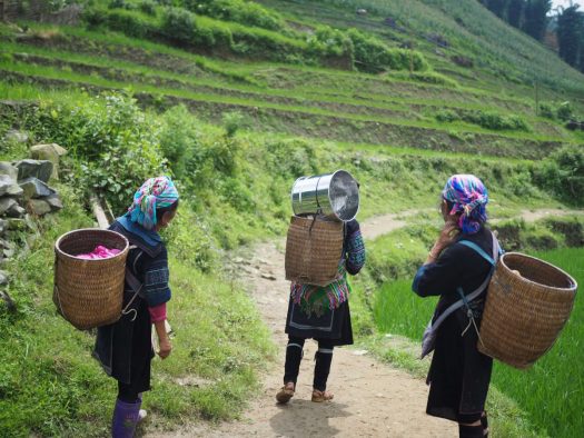 Traditional women in Vietnam. Women are impacted by climate change more than men as greater numbers of women live in poverty and are providers of food and fuel, making them more vulnerable to adverse weather. (Photo: Ives Ives on Unsplash)