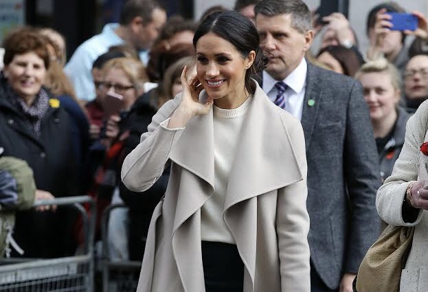 Meghan Markle loves a good coat and pencil skirt, a look she's been pulling off for years. [Credit: Wikimedia Commons]