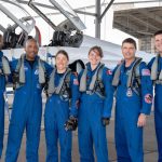 The Artemis II crew (with Christina Koch third astronaut from left) pose before they take off for their mission around the moon. The crew includes two backup members. (Credit: NASA)